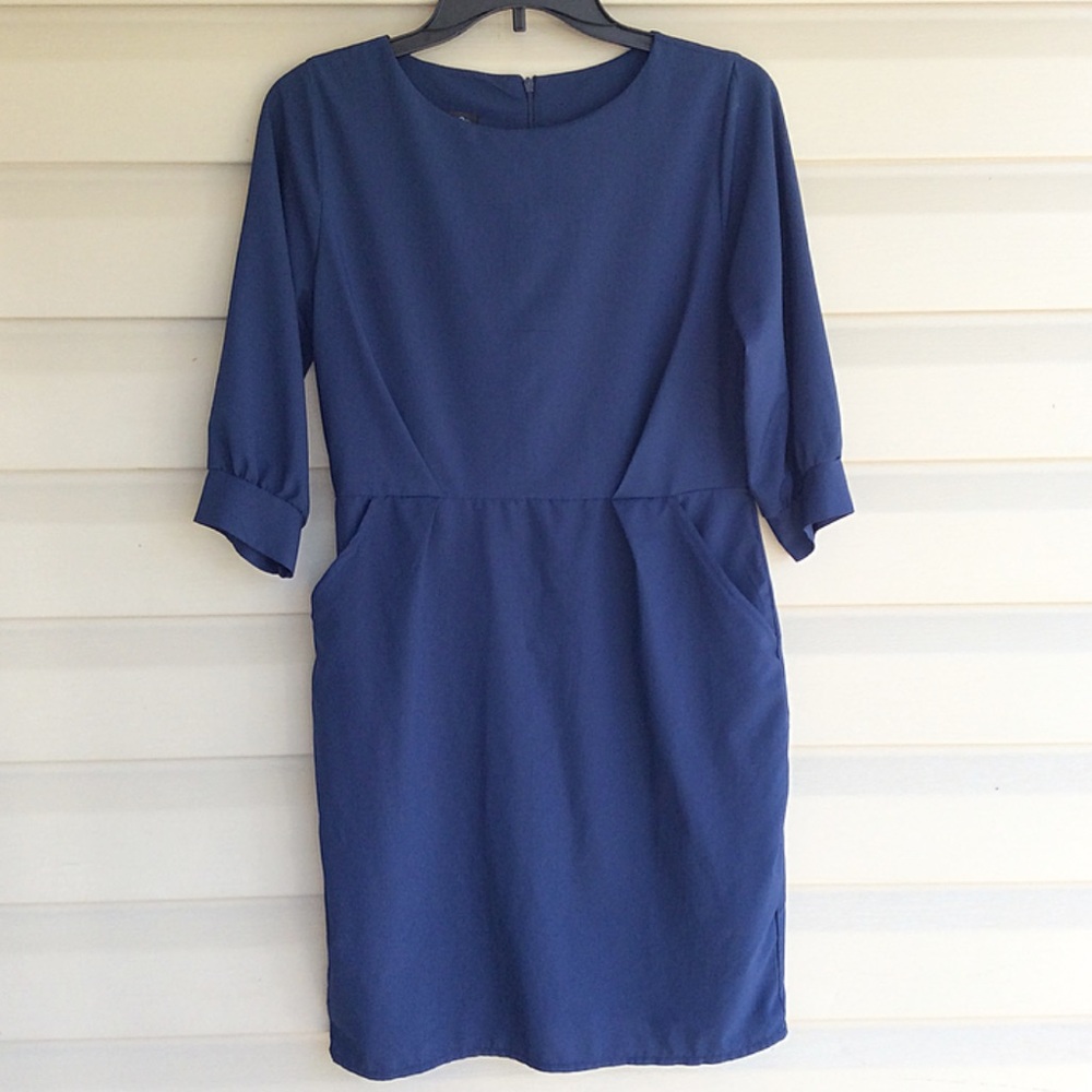 Navy, long sleeved dress with pockets. Size small